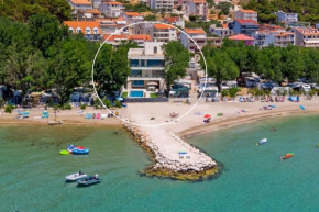 Beachfront Villa Erce with private 40sqm heated pool, a Gym, 7 en-suite bedrooms, a rooftop terrace, 2 living areas